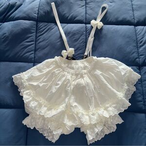 White floral bloomer shorts with bow strap suspenders